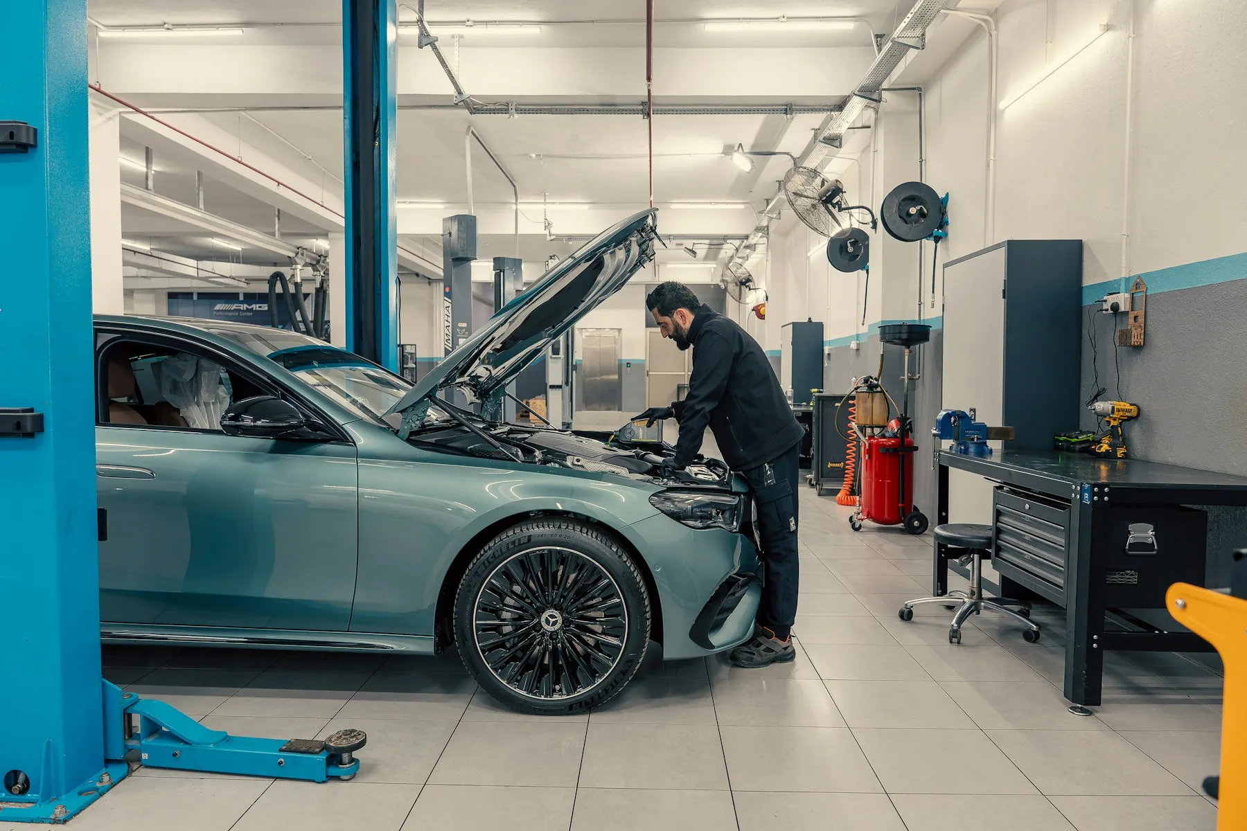 5 Reasons Michigan Business Owners Get Business Financing in 2026 2 Auto shop owner in Michigan with newly financed equipment
