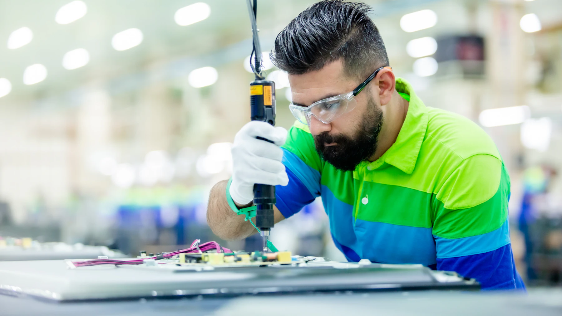 Section 179 and Year-End Equipment Purchases: How to Fund Equipment Before December 31 (2026) 2 Manufacturing shop owner at an equipment bench
