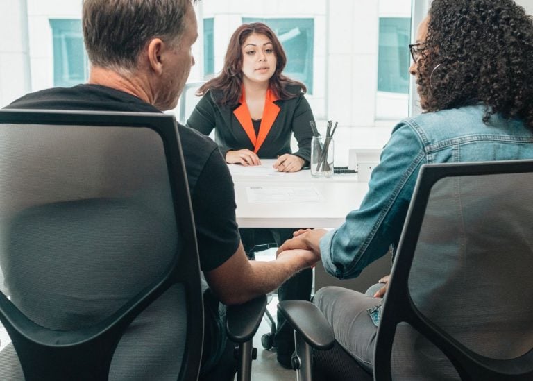Apply Today 3 Funding specialist going through paperwork with a business owner