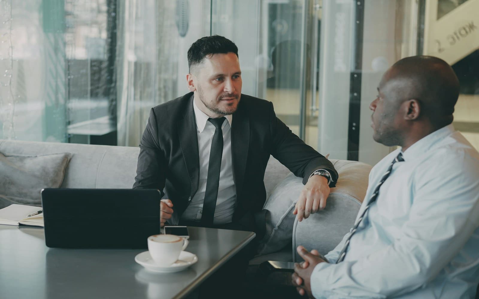 $200,000 Business Loan: How to Qualify and How Fast You Can Get Funded 2 Funding specialist reviewing matched offers with a business owner
