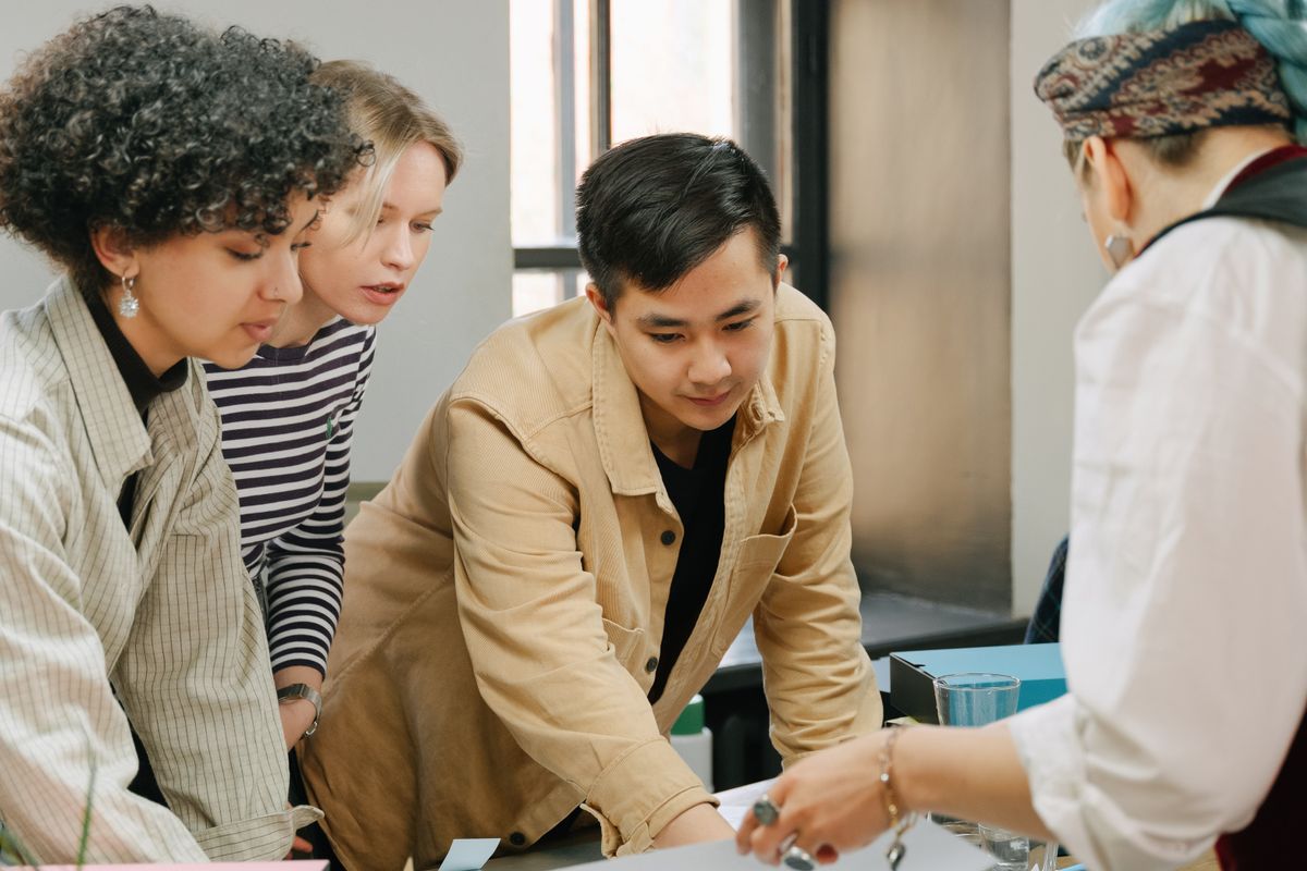 Small business owners reviewing figures with an adviser