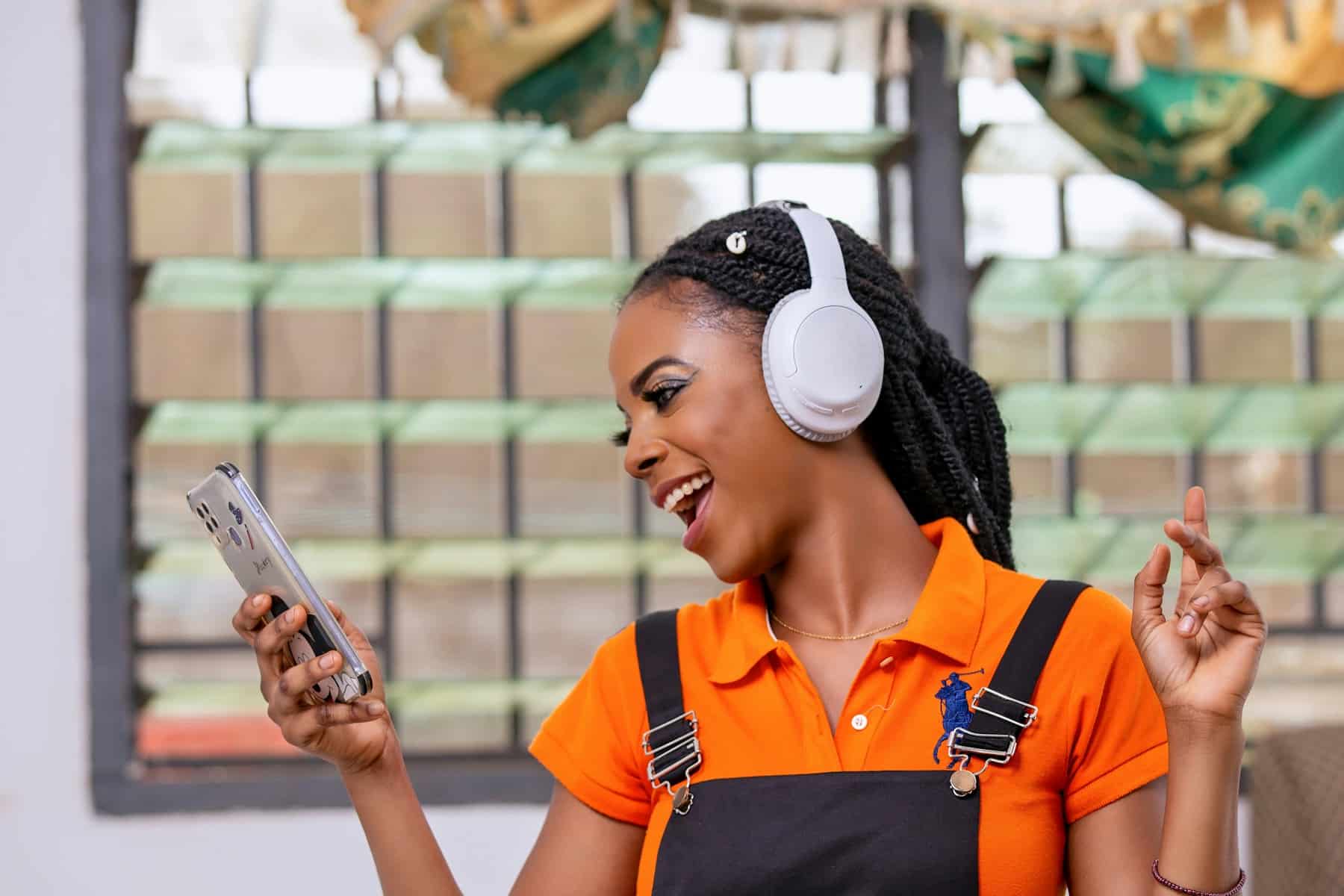 Small Business Loans | Funding for Your Business 3 Business owner smiling at a fast approval on her phone