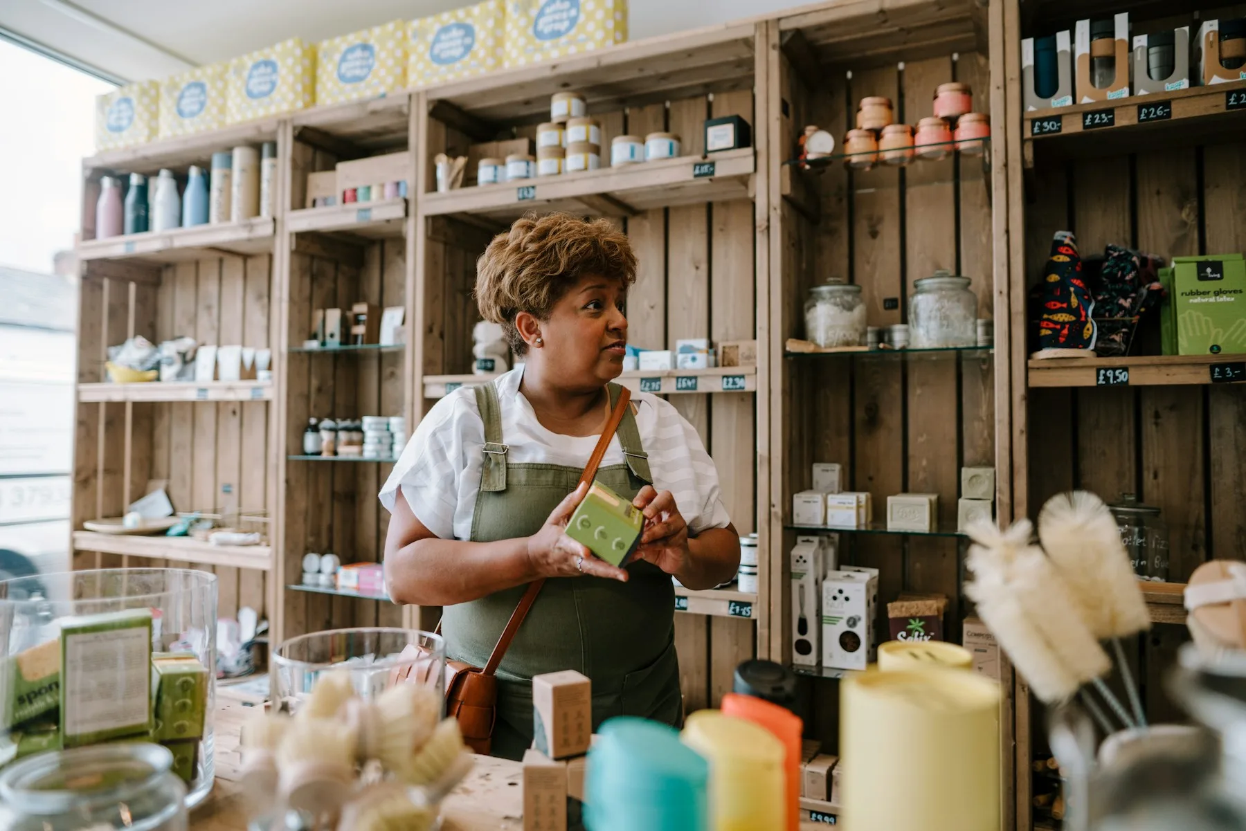 5 Reasons Minnesota Business Owners Get Business Financing in 2026 2 Minnesota retail store owner arranging inventory on shelves