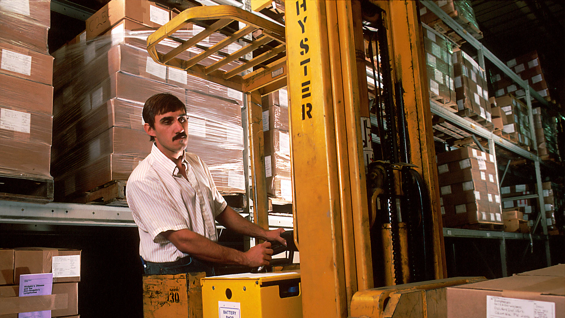 Inventory Financing: How to Fund Stock Before You Sell It 2 Forklift moving palletized inventory in a distributor warehouse