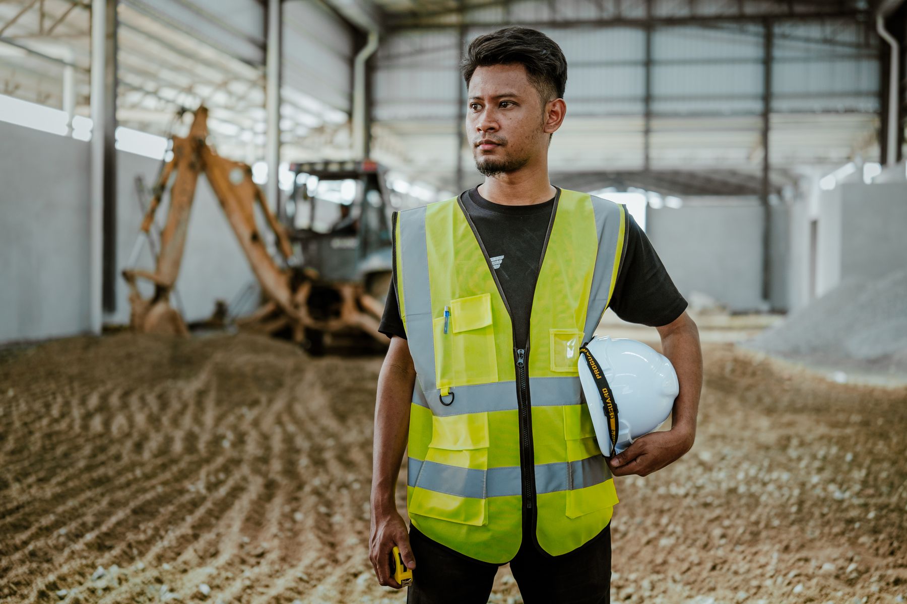 How to Get Approved for a $100,000 Business Loan Fast 2 Contractor in a safety vest on a job site