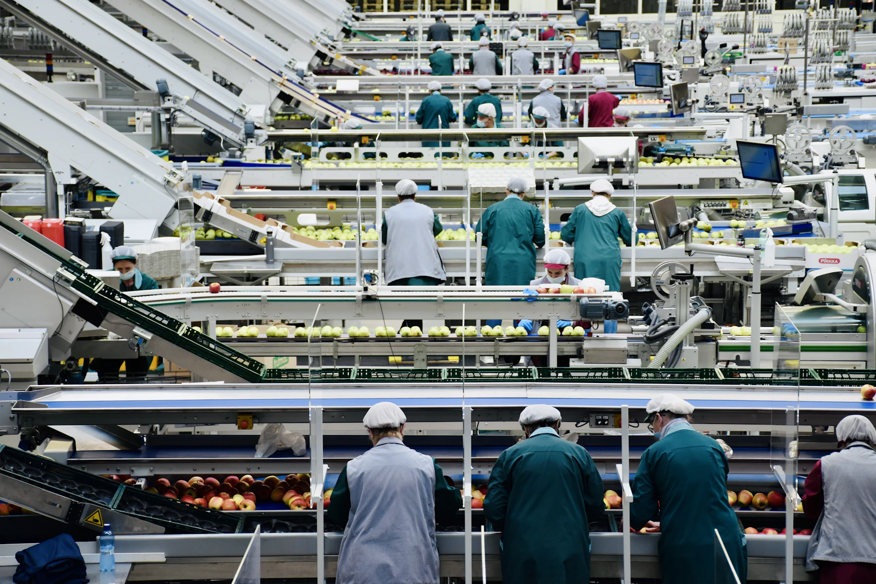 How to Get a $2 Million Business Loan: Requirements, Timeline and Options 2 Workers on a production line inside a factory