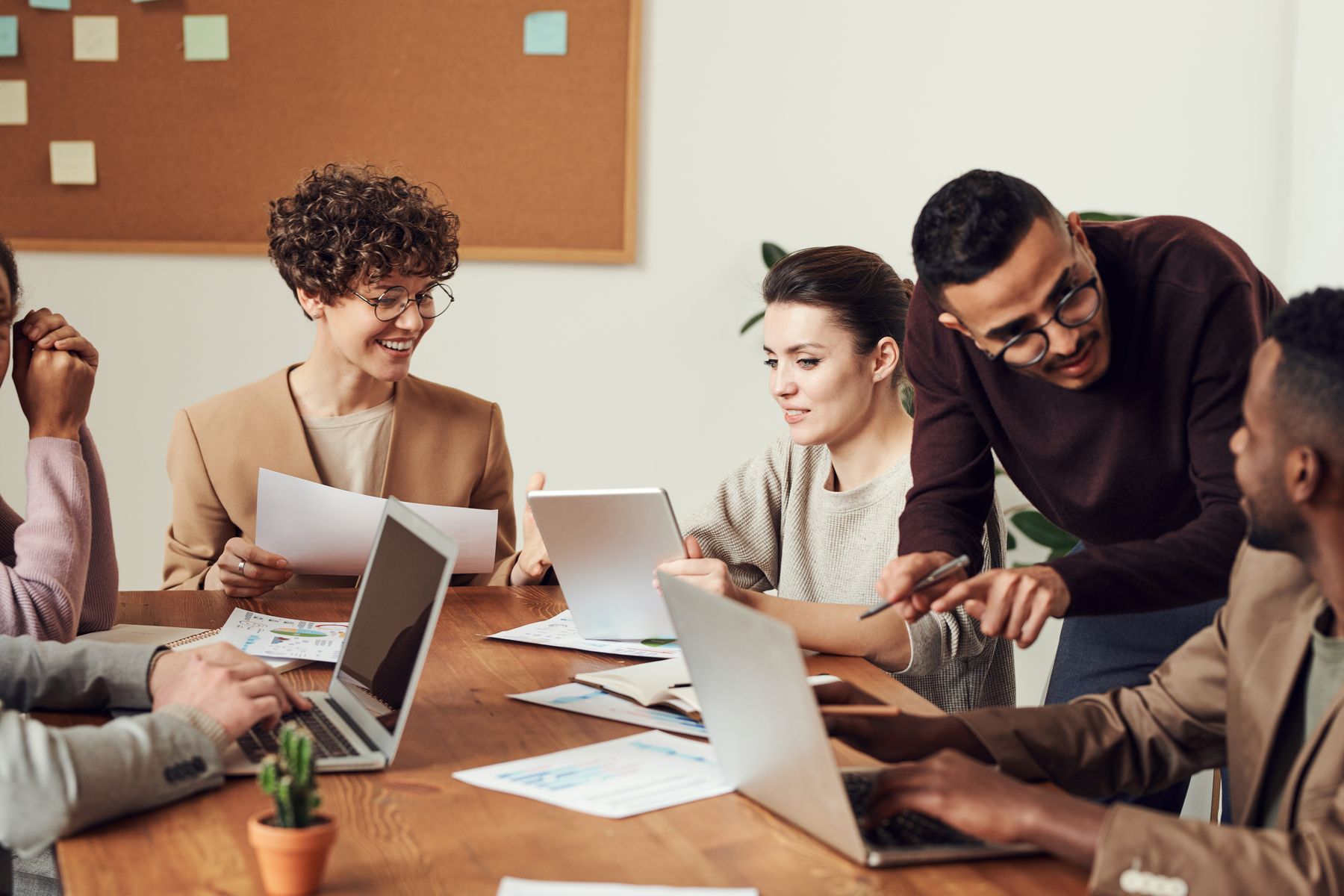 Best Small Business Loan Lenders in 2026: Who Approves What, and at What Cost 2 Entrepreneurs reviewing lender options on a laptop in a bright office