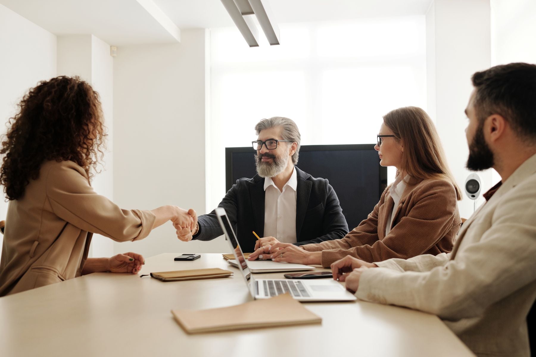 Business partners reviewing cash flow figures at a table