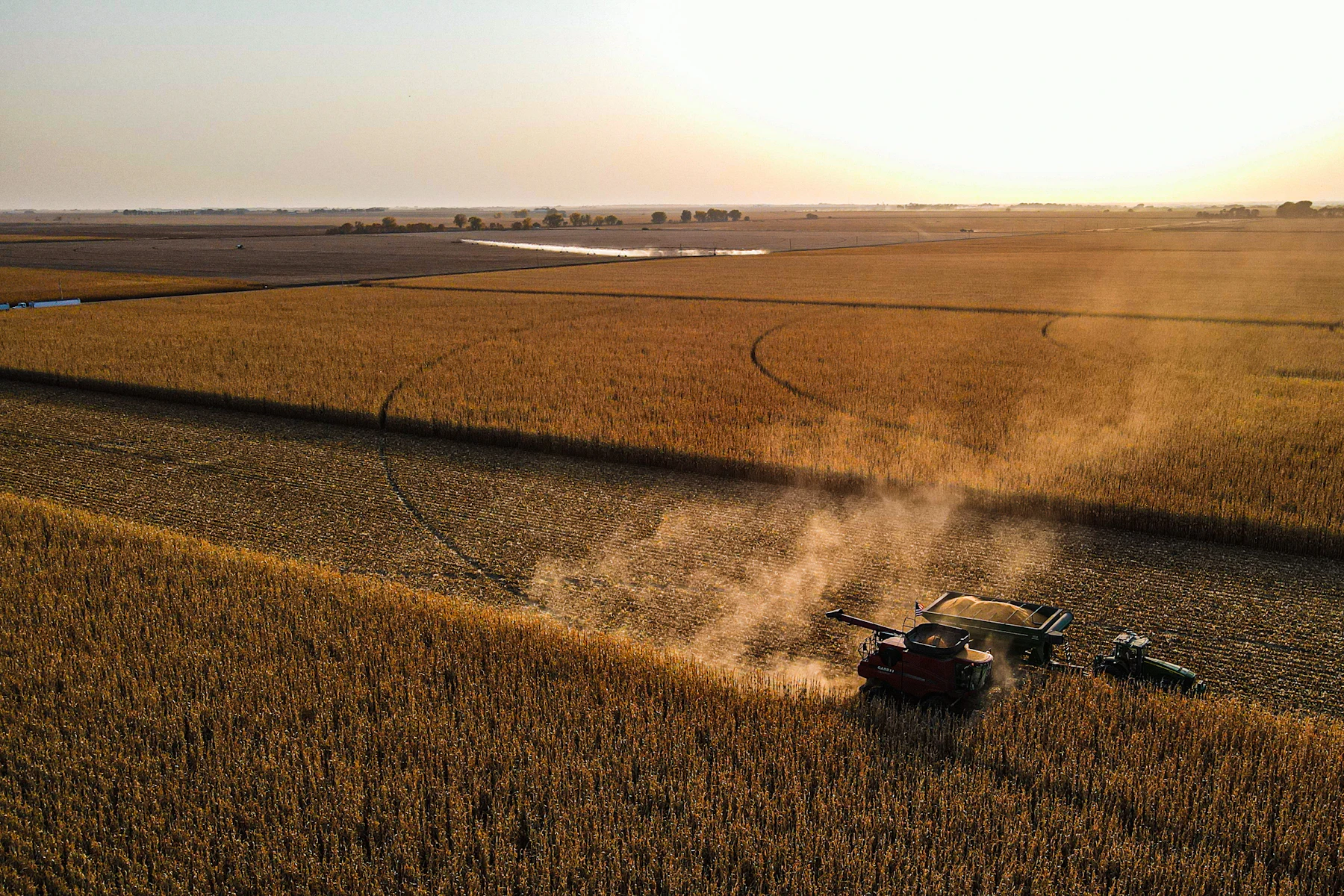 Farm machine working a brown field in Nebraska