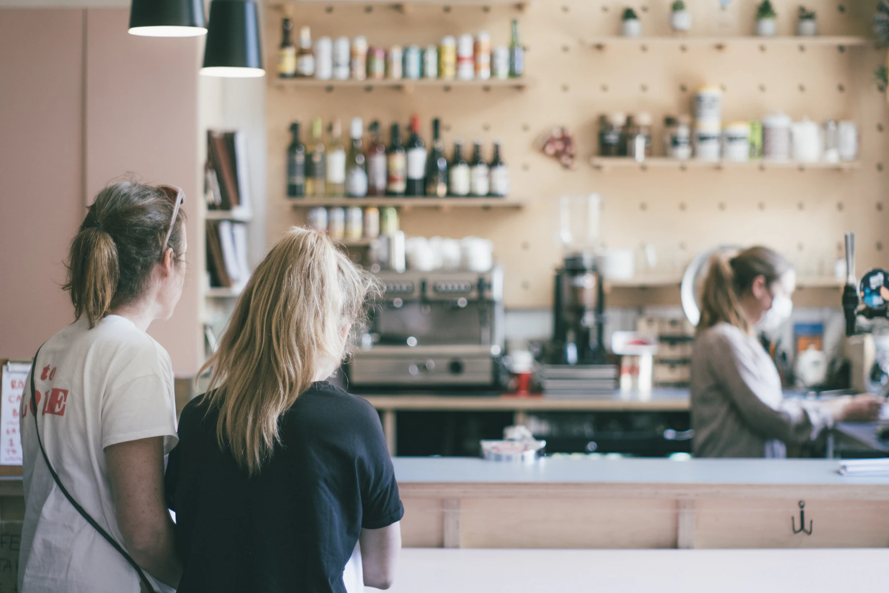 Can You Get Business Funding With an Existing MCA? 2 Two women standing at the counter of a cafe