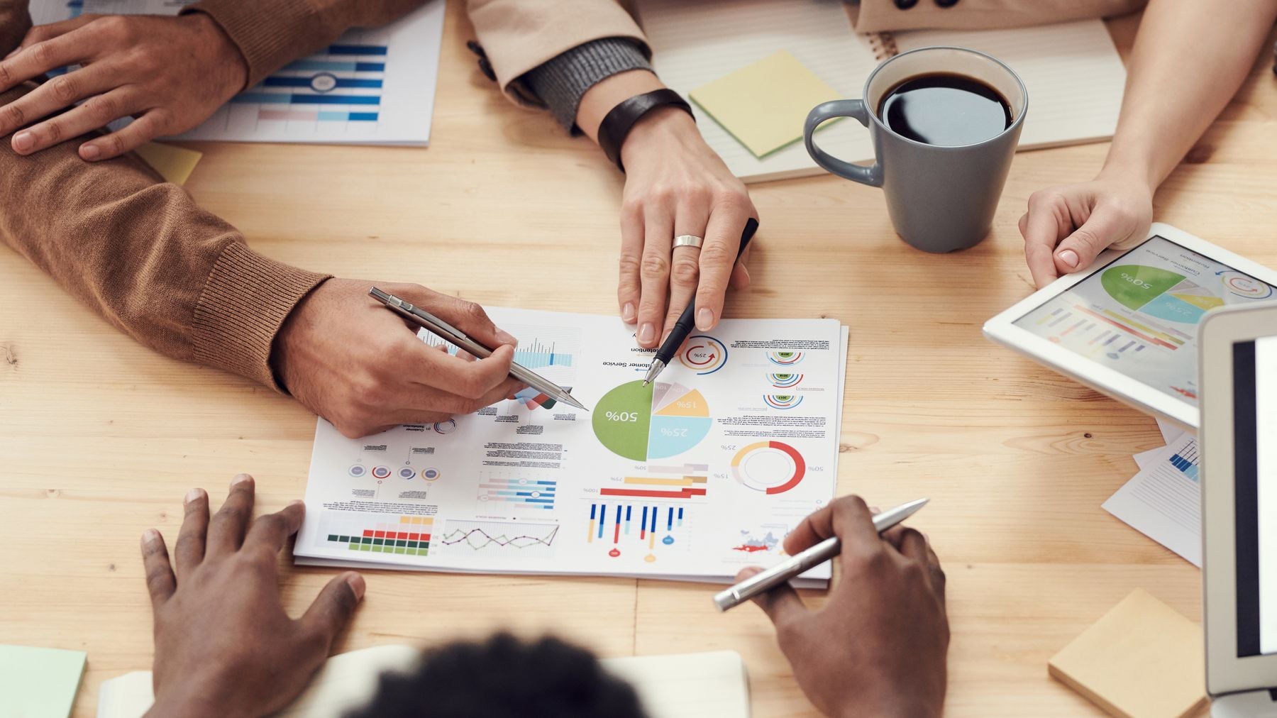 Business Loan Glossary: 44 Financing Terms Explained in Plain English (2026) 2 Team reviewing financing documents at a table