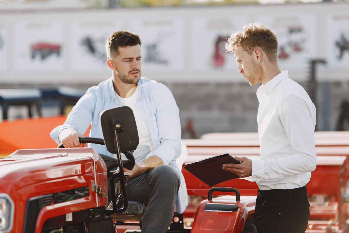 Business Loan Referral Program for Equipment Dealers and Vendors 2 Equipment dealer and buyer discussing a machine purchase on the lot