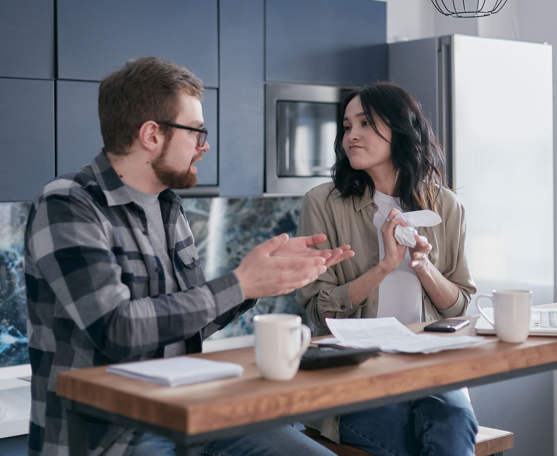 Business Loans for Low-Revenue Businesses: Options Under $10,000 a Month (2026) 2 Small business owners reviewing finances together at a table