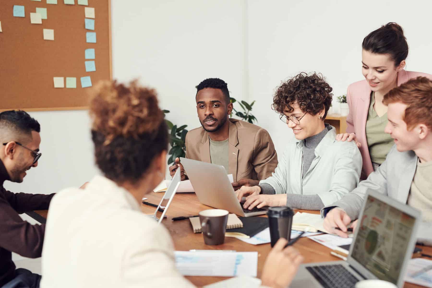 Business Loans in Pembroke Pines, FL: Local Funding Options, Rates and Requirements (2026) 2 Small business team reviewing plans together in an office