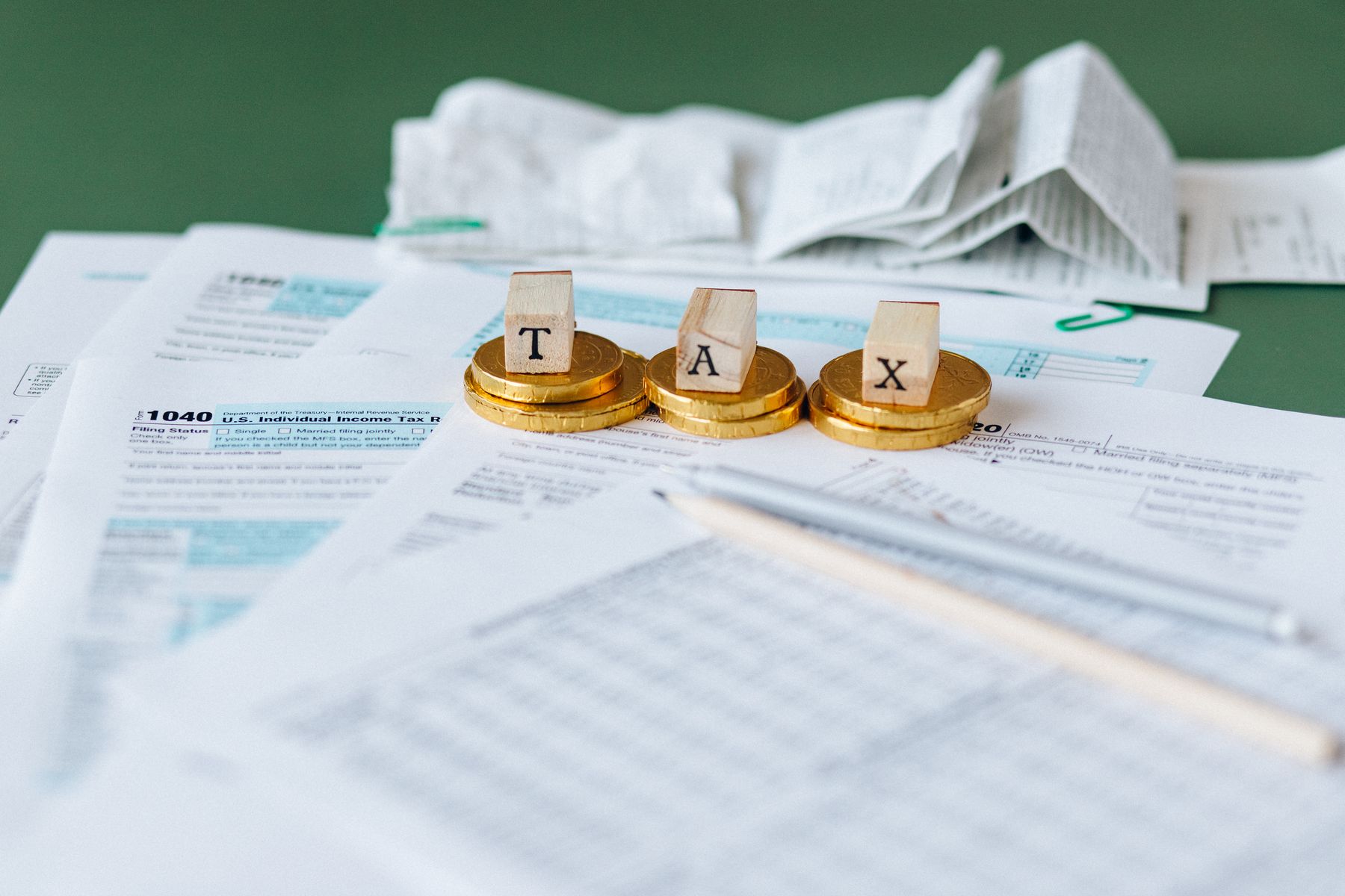 Business Loans With a Tax Lien: What Gets Approved, What It Costs and How to Fix the File (2026) 2 Business owner reviewing a tax notice at a desk