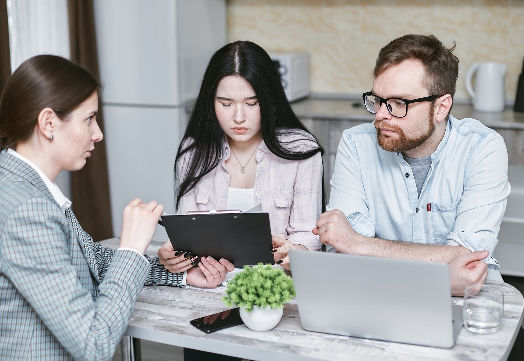 Business Term Loans: Rates, Terms, Requirements and How to Qualify 2 Business owner reviewing a fixed repayment schedule at her desk