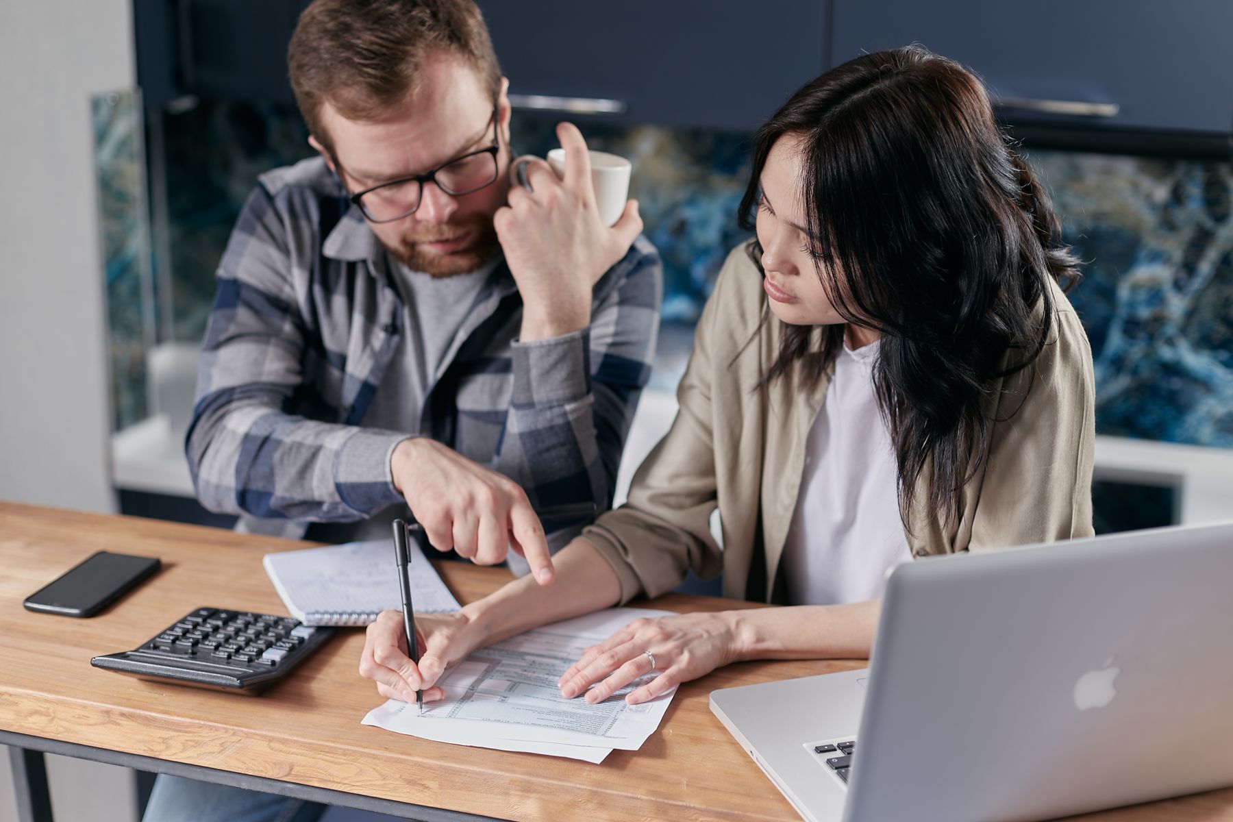 Denied for an SBA Loan? What to Do Next (and Faster Alternatives) 2 Two business owners reviewing financial documents after an SBA loan decline