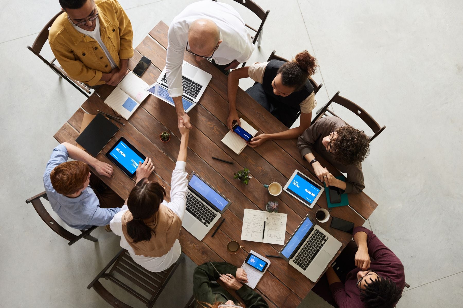 Emergency Business Line of Credit: How to Open One Fast and Use It Right (2026) 2 Team working urgently on laptops and documents at a shared desk