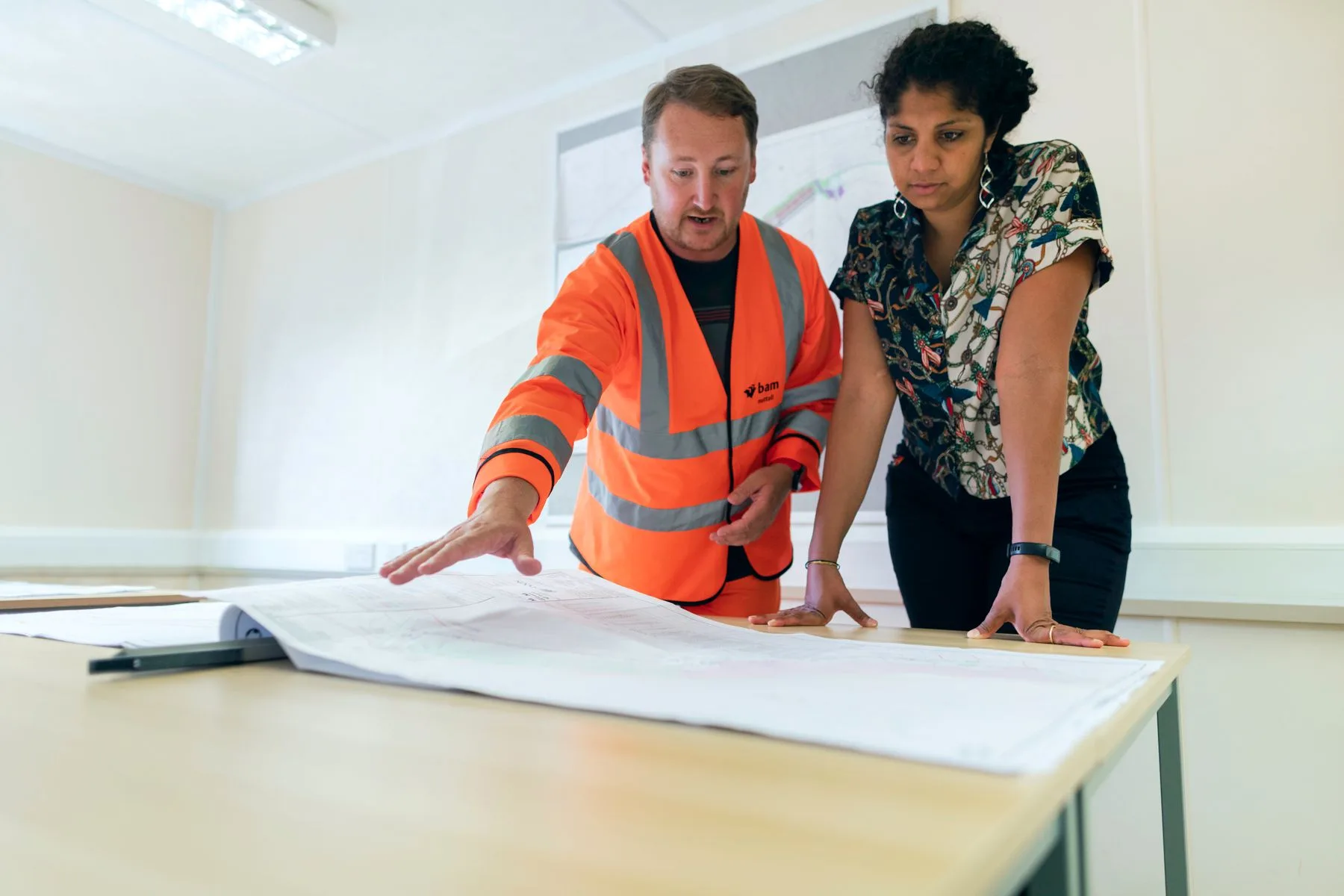Engineering & Architecture Firm Business Loans: Options, Speed 2 Two engineers reviewing blueprints in an office