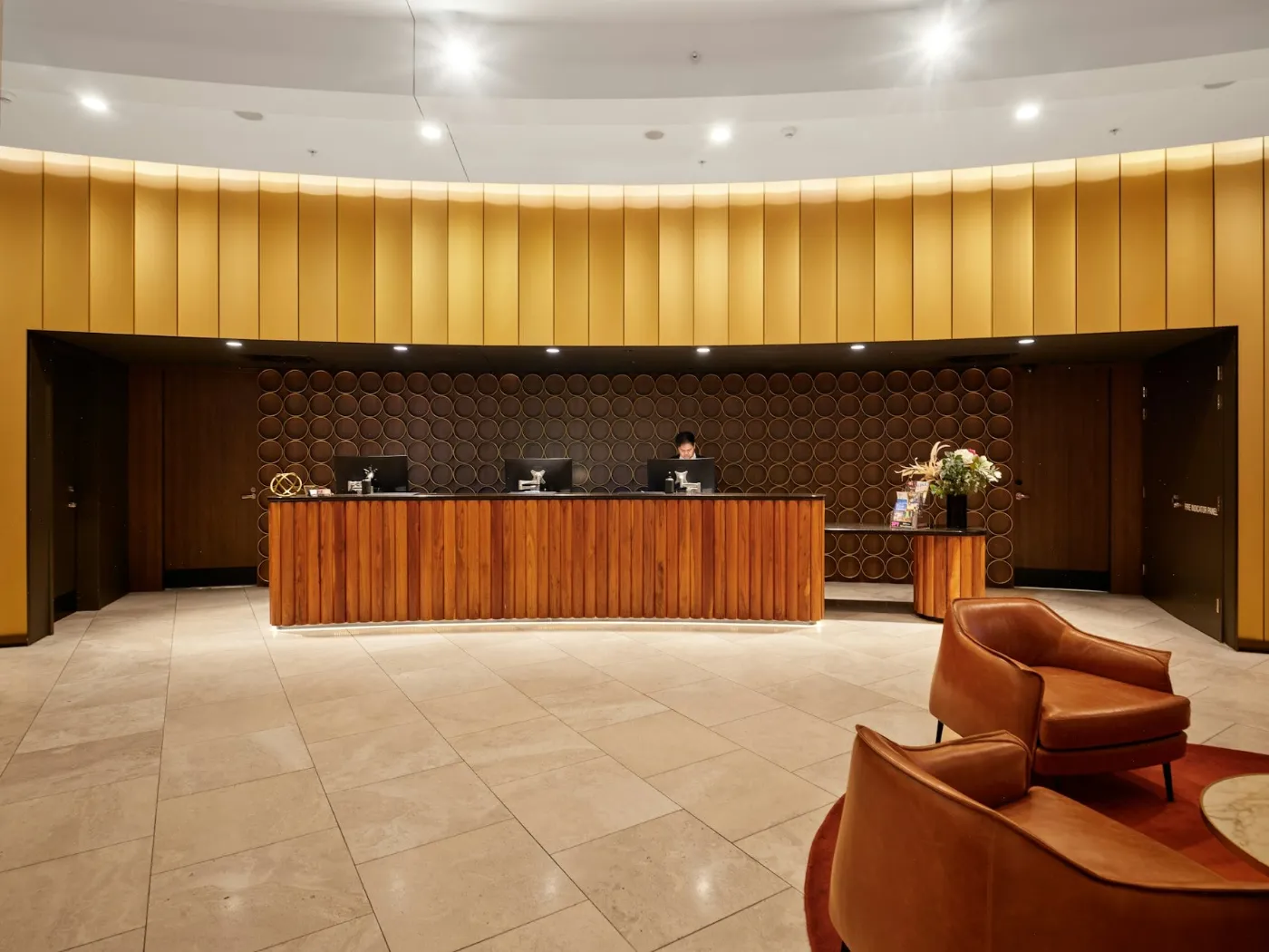 Hotel Business Loans: Working Capital for Hotels and Motels 2 Hotel reception desk with staff in a modern lobby