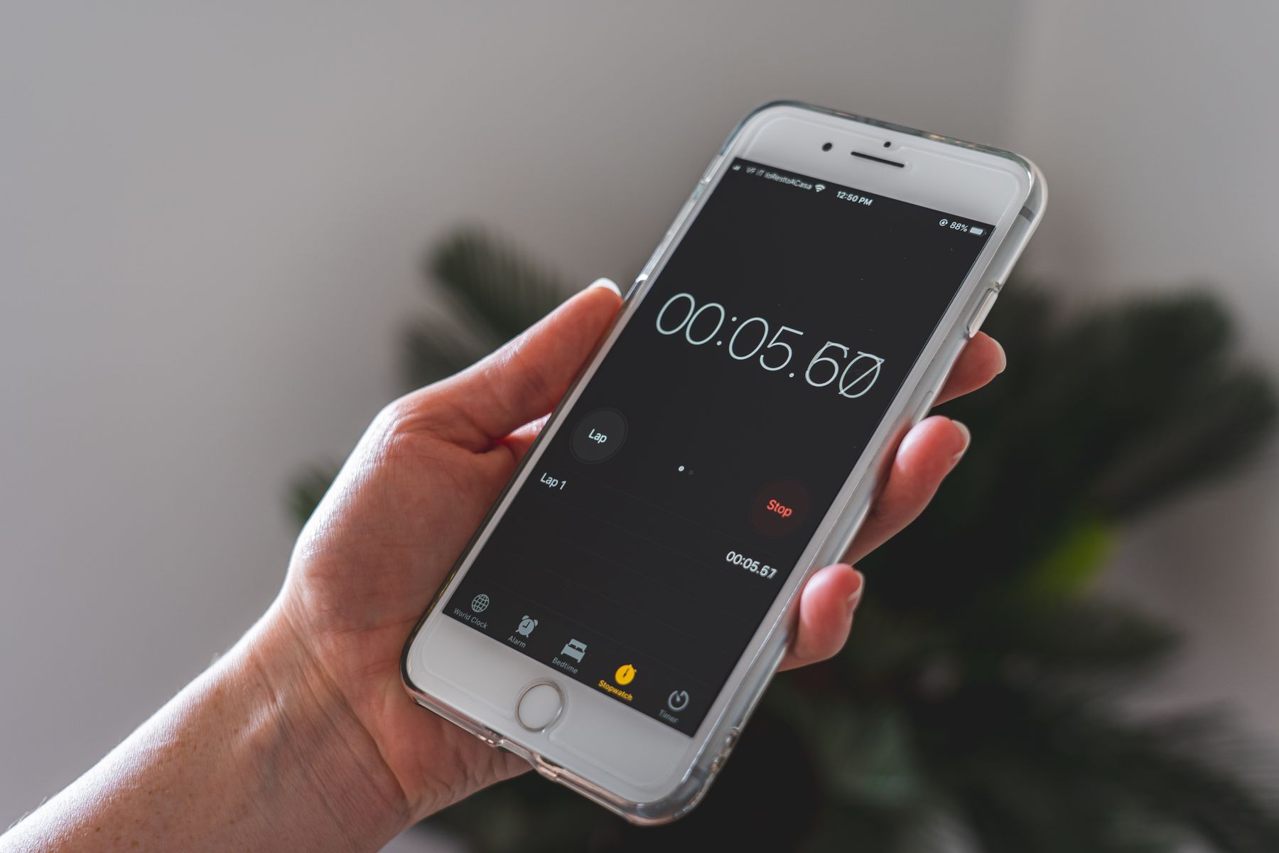 How Fast Is Equipment Financing? Realistic Timelines in 2026 2 Hand holding a smartphone with a stopwatch running