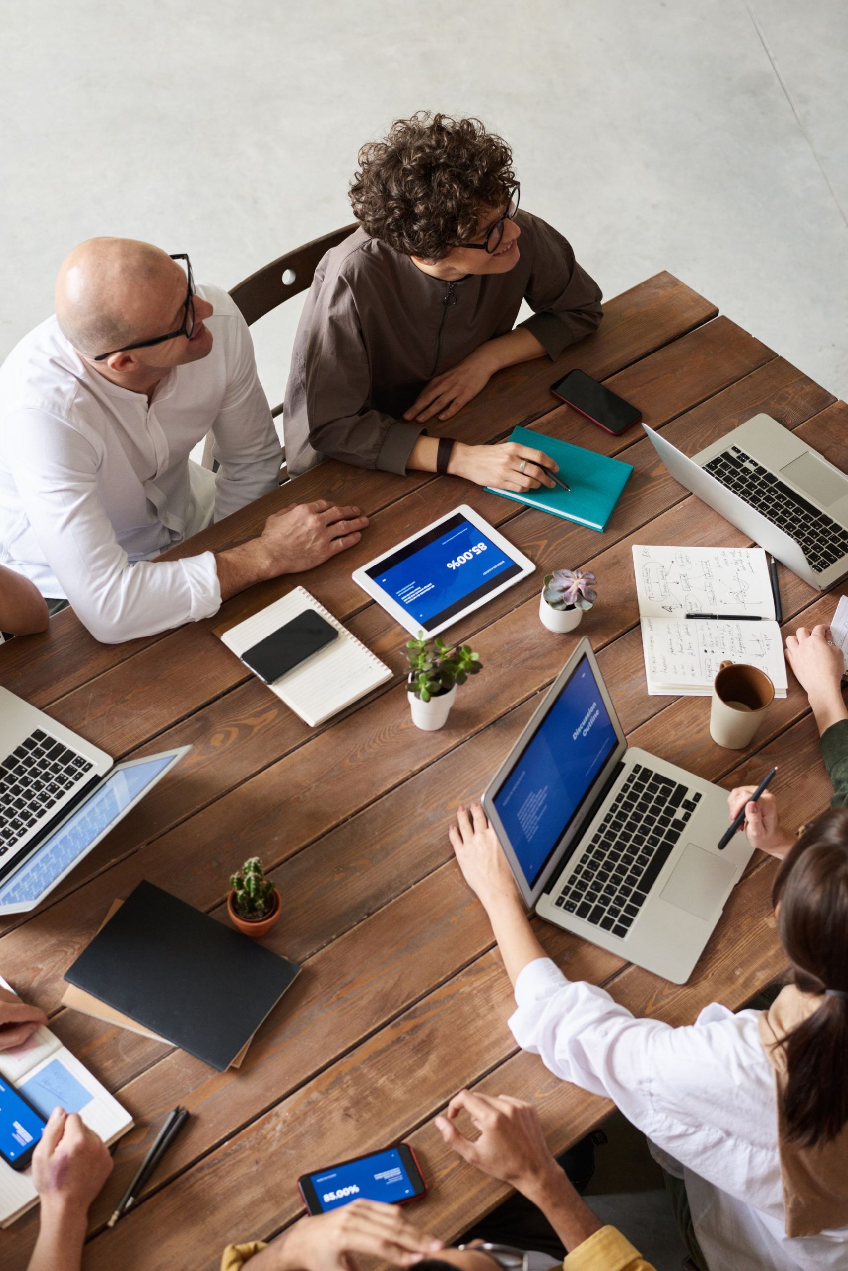 How Lenders Read Your Business Bank Statements: The 9 Things Underwriters Check (2026) 2 Underwriter reviewing bank statements on a laptop