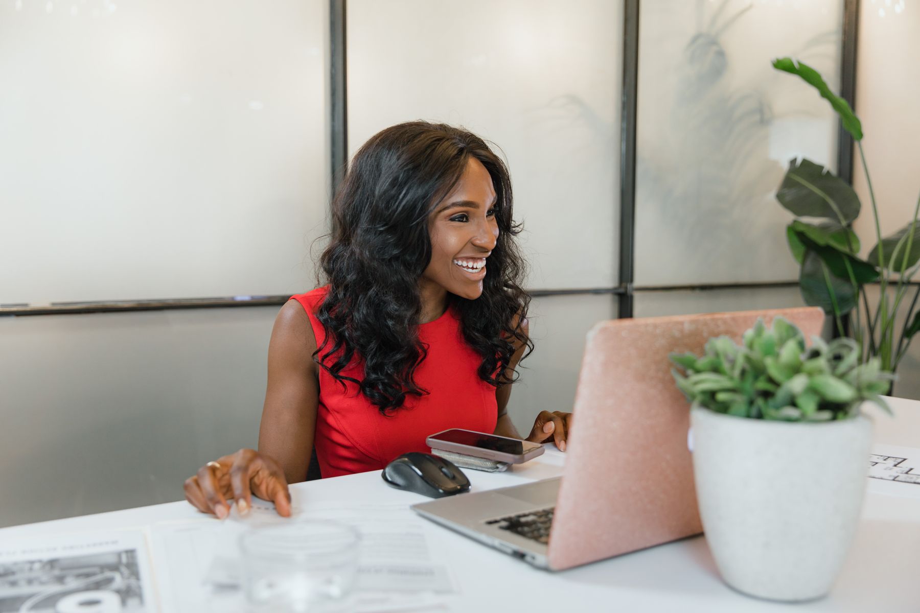 How Much Business Line of Credit Can I Get? Limits by Revenue and Credit 2 Business owner calculating figures with a laptop and spreadsheet printouts