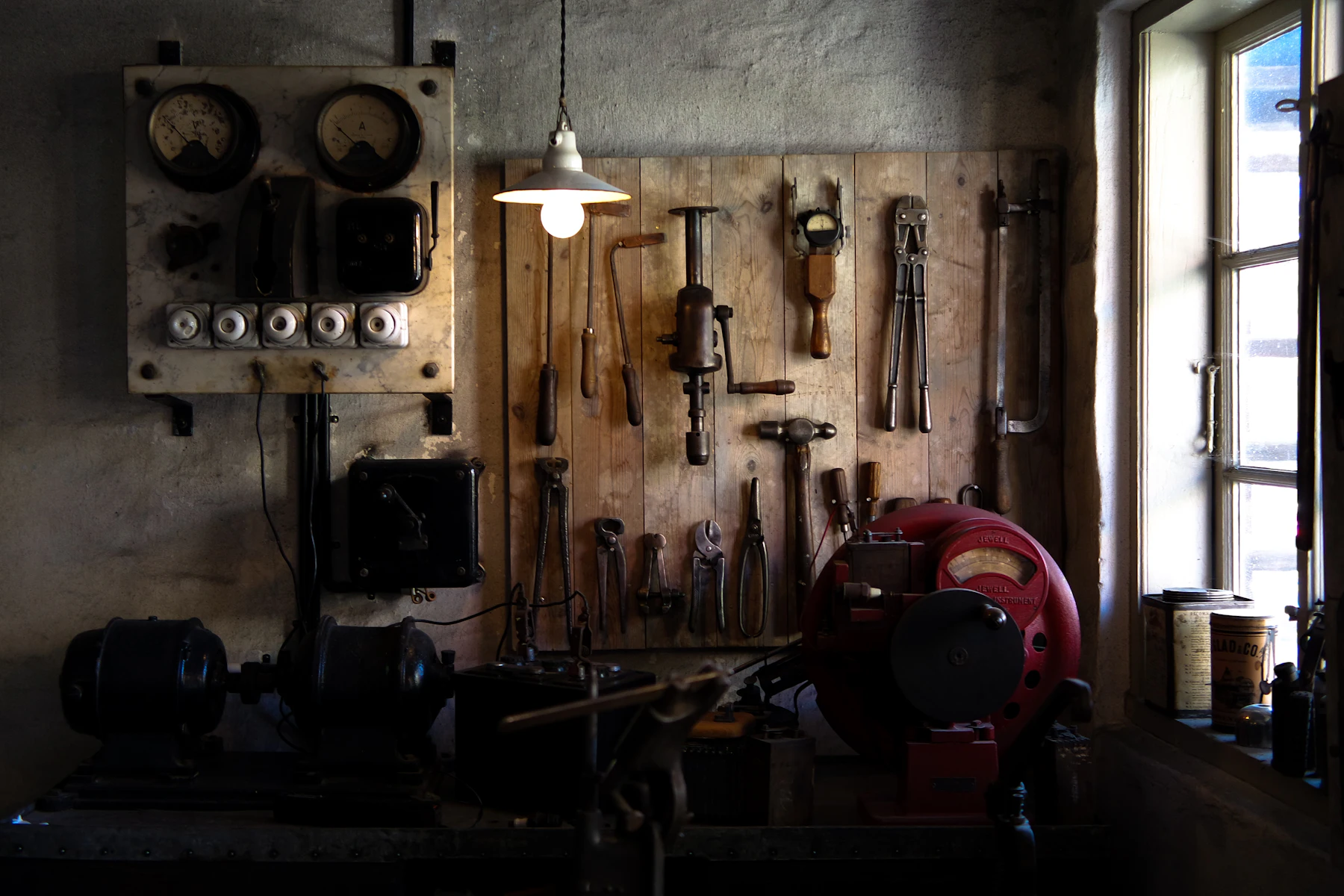 The Equipment Still Runs. But Is It Holding Your Business Back? 2 Workshop wall with tools and machinery