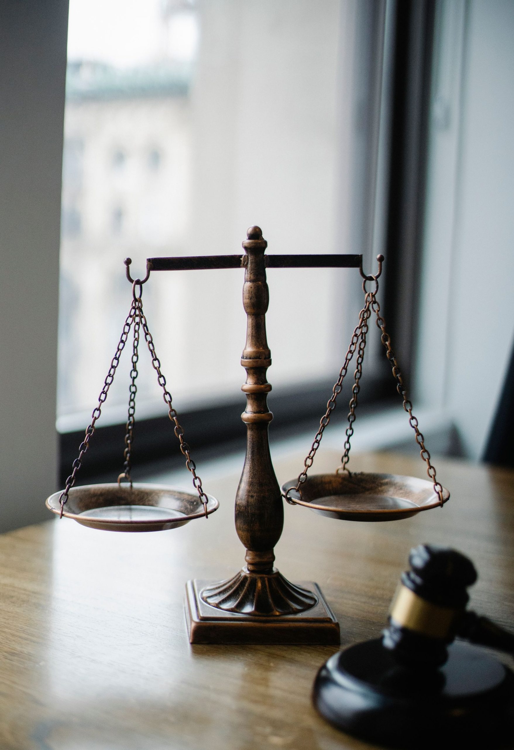 Law Firm Business Loans: Case Costs, Payroll, Expansion and Partner Buy-Ins (2026) 2 Scales of justice on a law firm desk