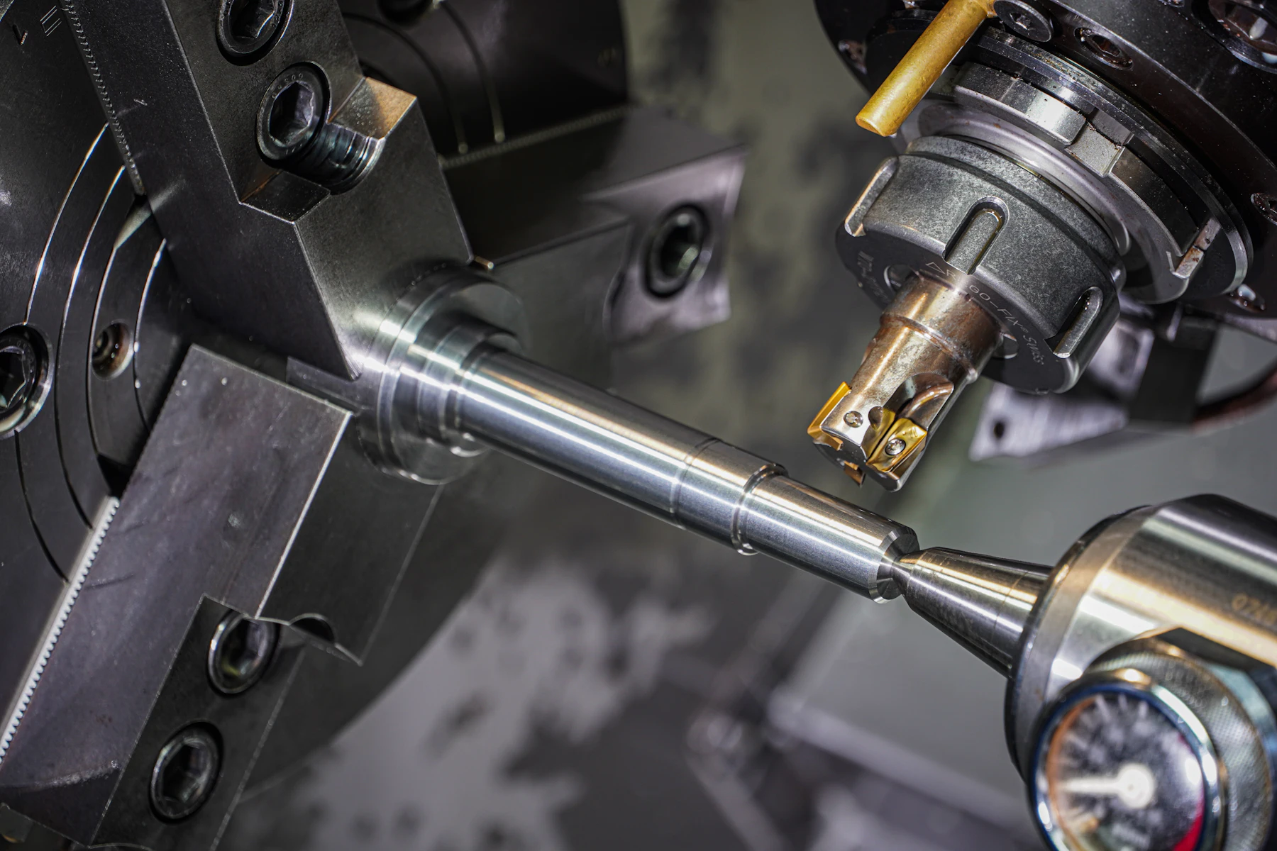 Machine Shop Business Loans: Funding for CNC and Job Shops 2 Metal rod held in a lathe chuck being machined by a cutting tool
