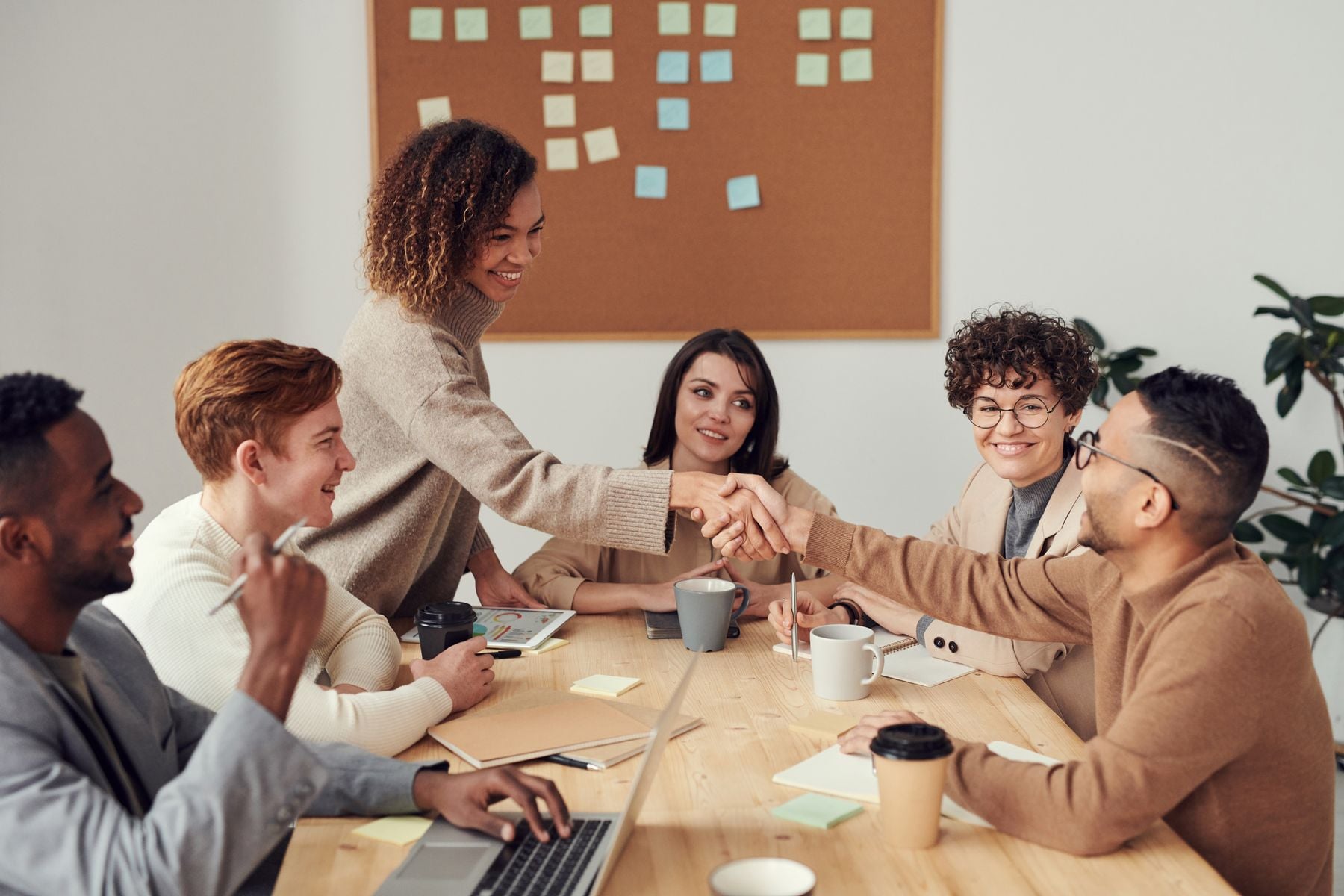 Quick Business Loans: Quick Approval, Quick Application, Funded in 24–48 Hours (2026) 2 Business team celebrating a quick approval around a table