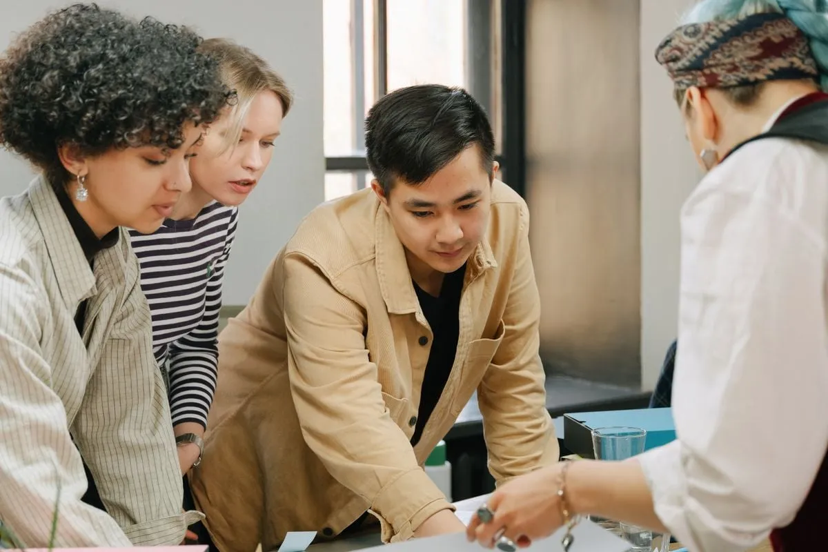 Small business owners reviewing figures with an adviser
