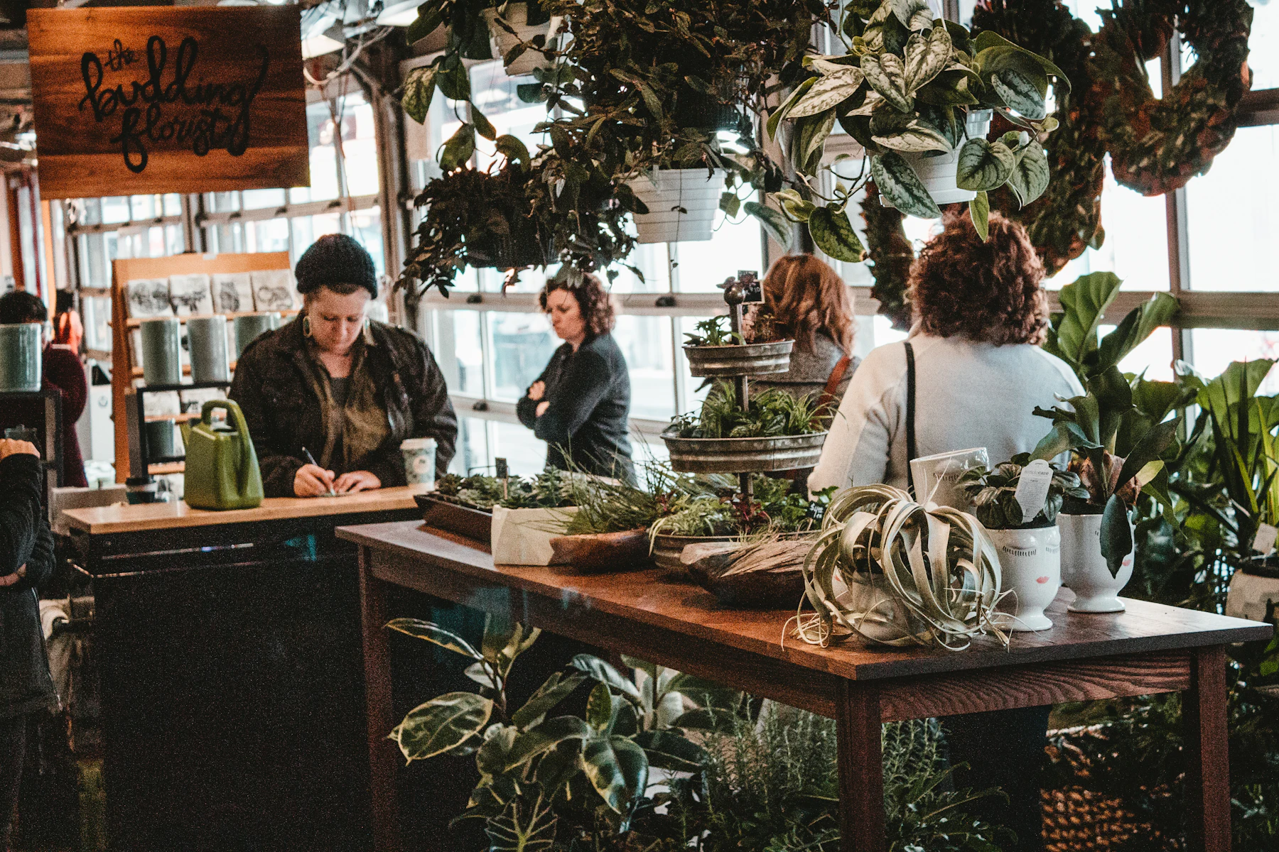 Revolving Business Line of Credit: How Draws and Repayment Work 2 Group of people standing around a wooden table