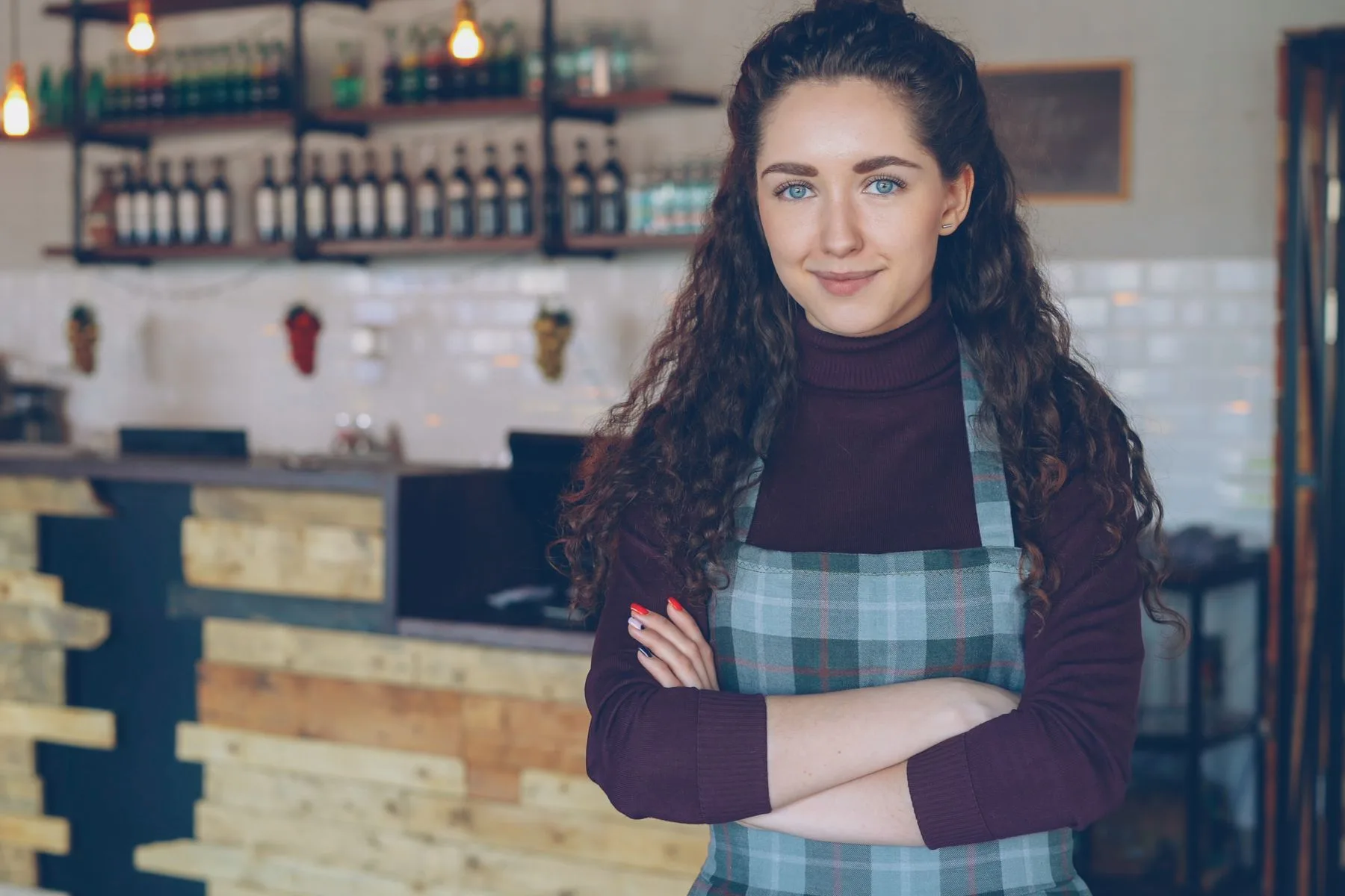 Same Day Business Loan Requirements: What It Really Takes 2 Cafe owner behind the counter of a cozy coffee shop early in the day