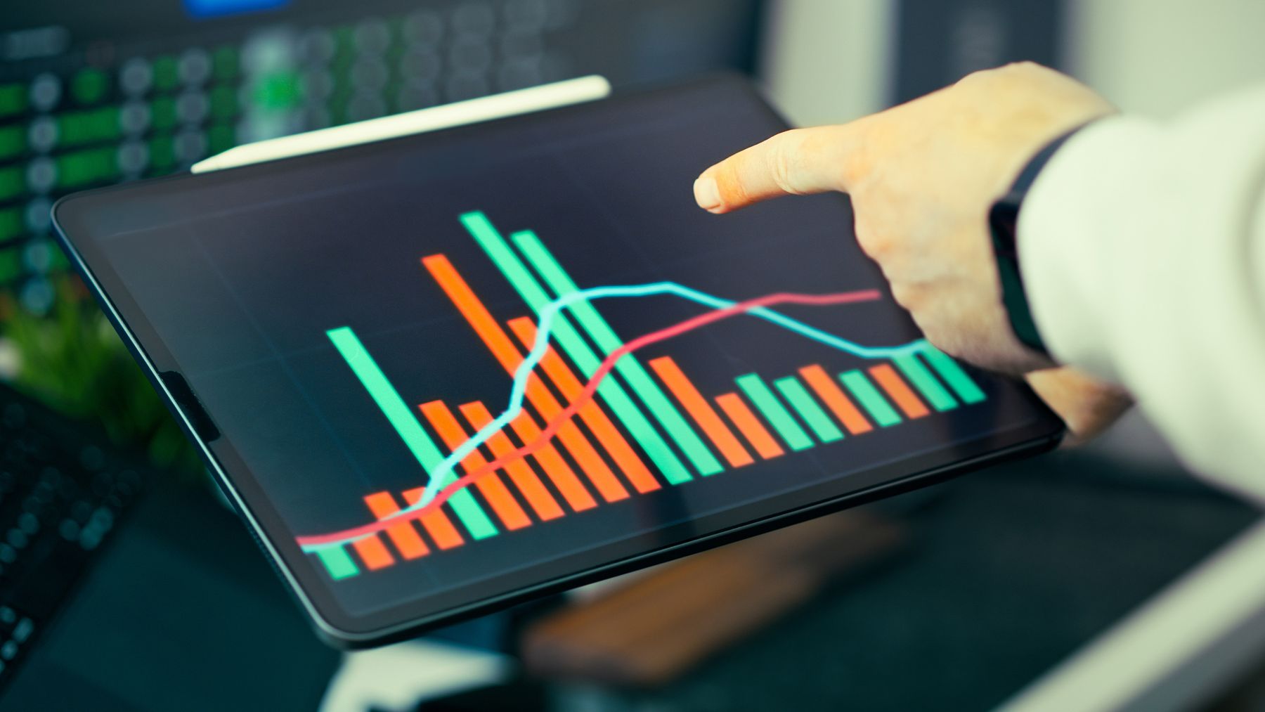 SBA 7(a) Lending Fell 28% in Fiscal 2026: Why Approvals Dropped and What It Means for Your Application 2 Business owner reviewing a declining lending chart on a tablet