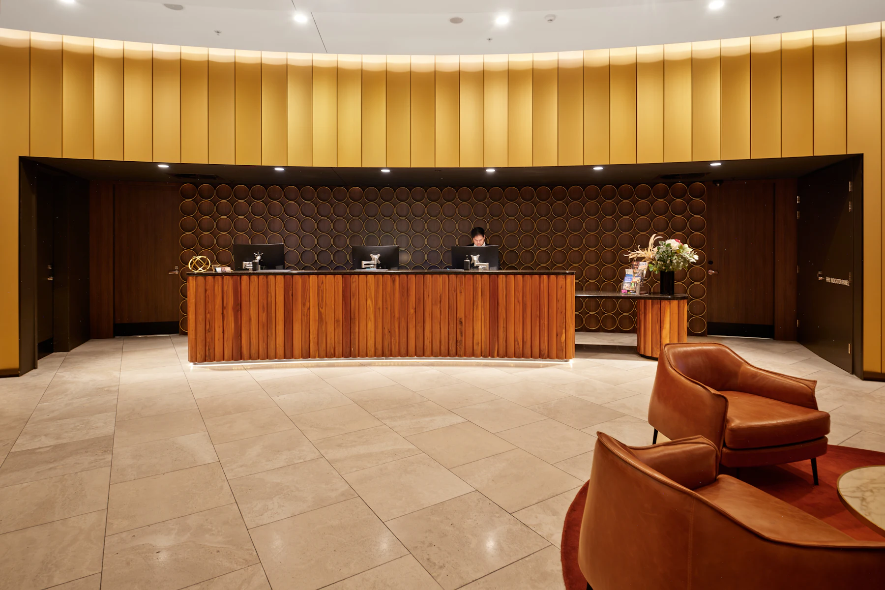 SBA 7(a) Loan Sizes by Industry: Why Hotels, Gas Stations, Vet and Dental Practices Get Seven-Figure Approvals 2 Hotel reception desk with modern wooden furniture and seating