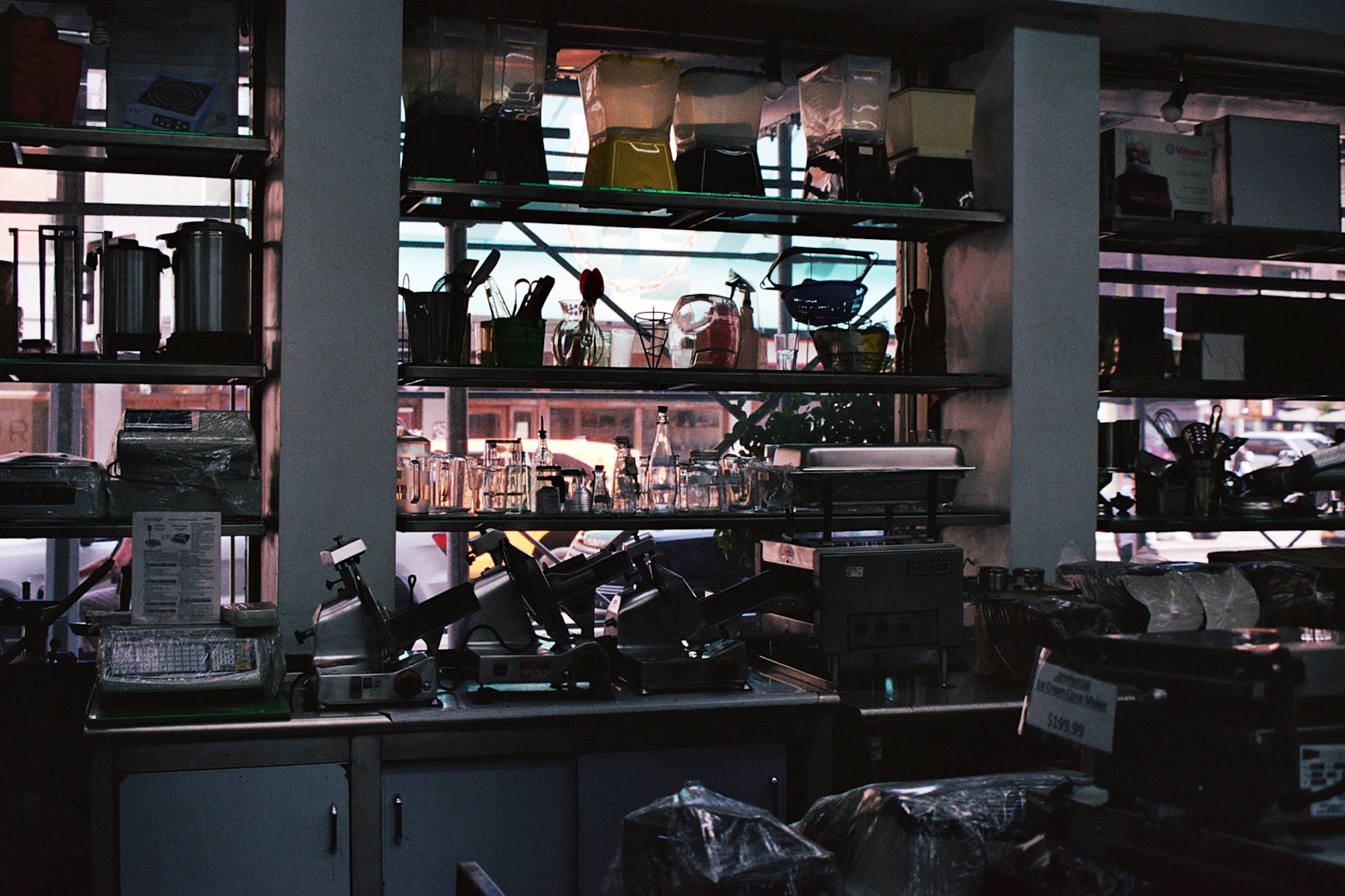 Section 179 and Year-End Equipment Purchases: How to Fund Equipment Before December 31 (2026) 2 Shelves stocked with equipment and containers behind a counter