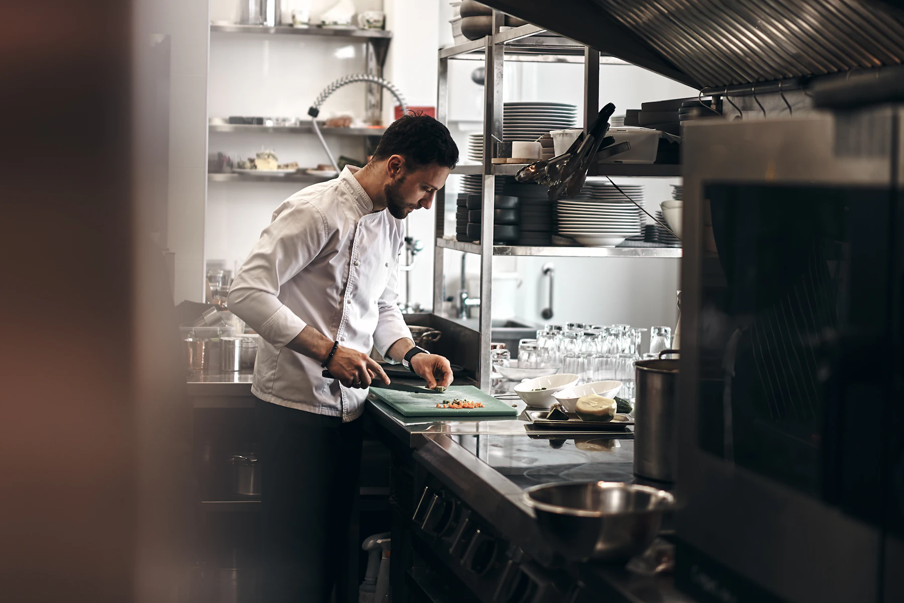 Urgent Business Loans: Options When You Need Funding This Week 2 Chef in a white coat chopping vegetables on a green board