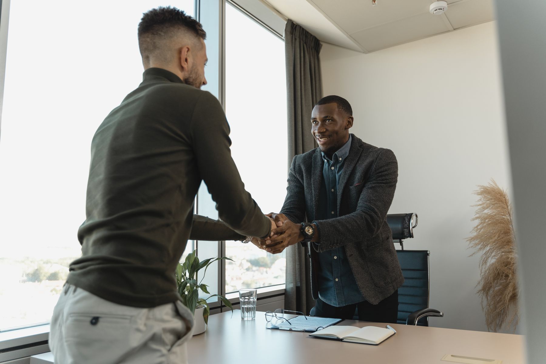 Where to Get a Business Loan in 2026: 7 Sources Compared by Approval Odds, Cost and Speed 2 Business owner shaking hands with a lender after an approval