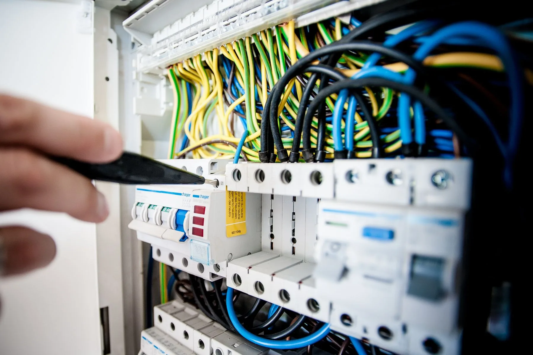 Working Capital by Industry: Contractors, Restaurants & Medical 2 Electrician working inside an open switchboard
